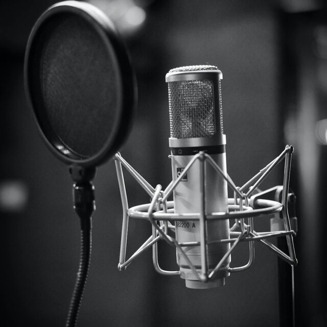 behind a microphone