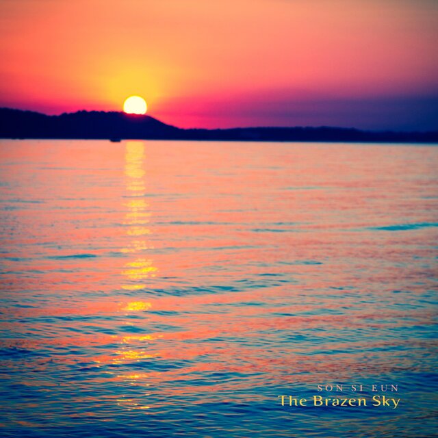 Under a reddish sky