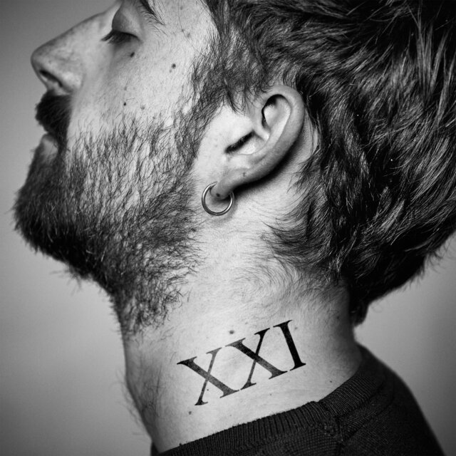 XXI